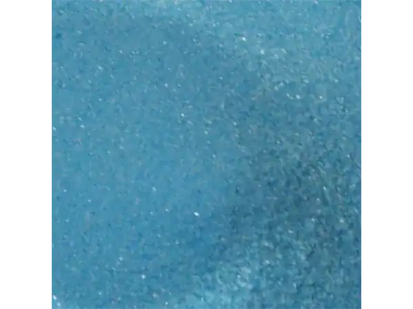 Close-up of blue glitter sugar sprinkles for desserts and confections.