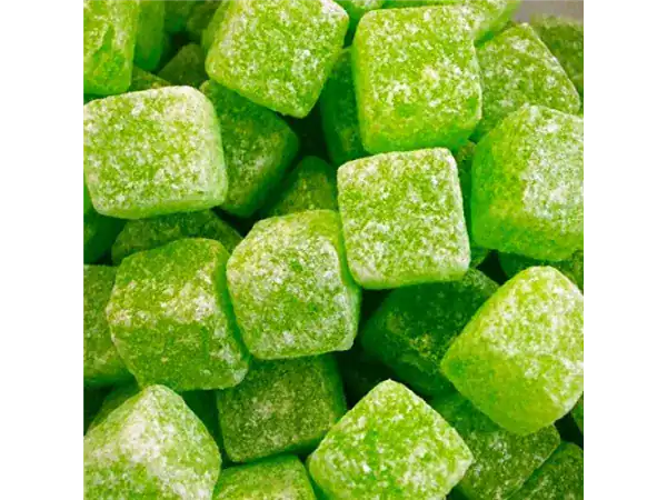 Vibrant green sugar cubes coated with crystal sugar, perfect for sweetening beverages and desserts.
