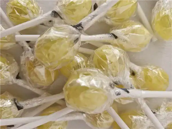 Colorful candy lollipops wrapped in clear plastic for special treats.