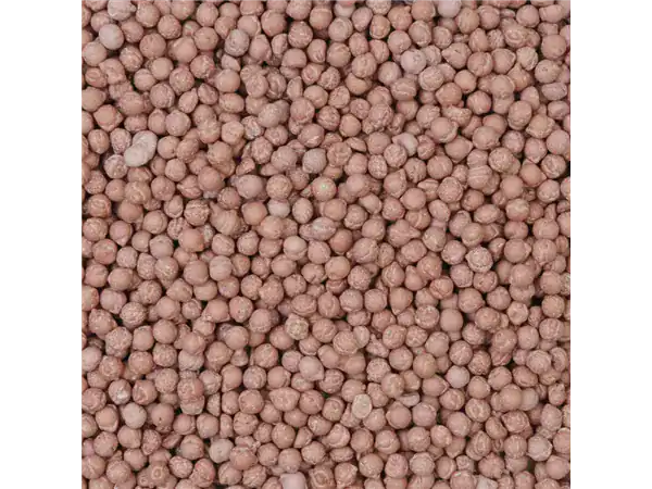 Colorful tiny pink candy pearls for baking and decoration.