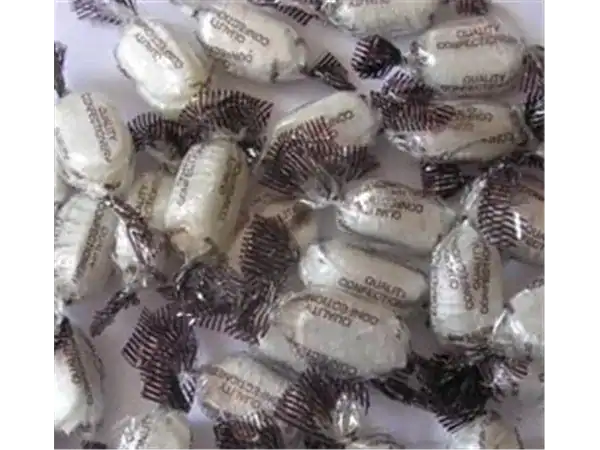 Delicious Roch Sweets caramel candies in white wrapping. Perfect for gifting or snacking.