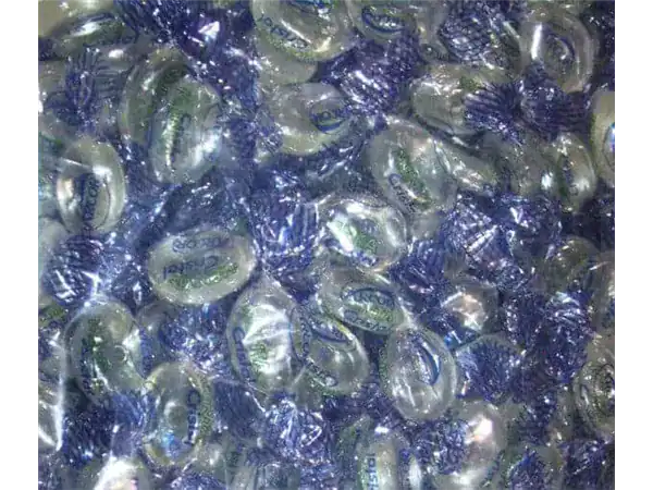 Colorful wrapped peppermint candies in blue and transparent wrappers.