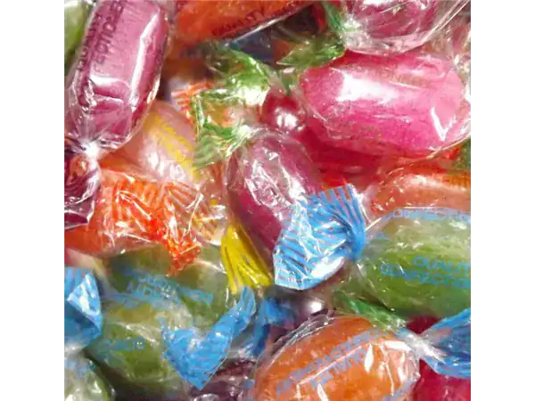 Brightly colored assorted candies in transparent wrappers ideal for snacking or gifting.