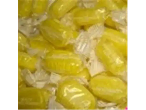Bright yellow citrus candies from Roch Sweets showcasing delicious lemon flavor.
