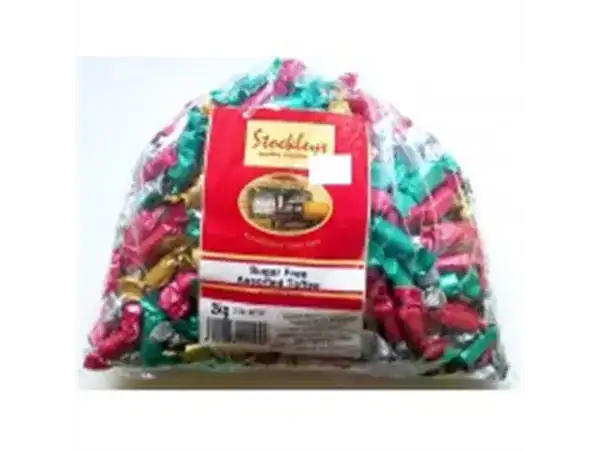 Colorful wrapped candies in clear bag for snacks and treats.