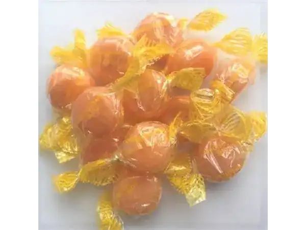 Delicious handmade caramel candies wrapped in yellow foil, perfect for sweet cravings and gifting.