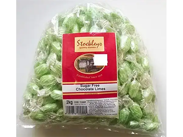 Alt: Fresh sugar-free green chocolate limes in packaging from Roch Sweets.