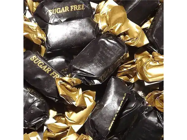 Delicious sugar-free candies wrapped in black and gold for a tasty, guilt-free treat. Perfect for health-conscious sweet lovers.