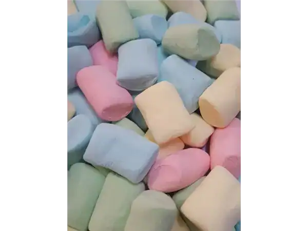 Assorted pastel marshmallows and sweets in soft colors for dessert lovers.