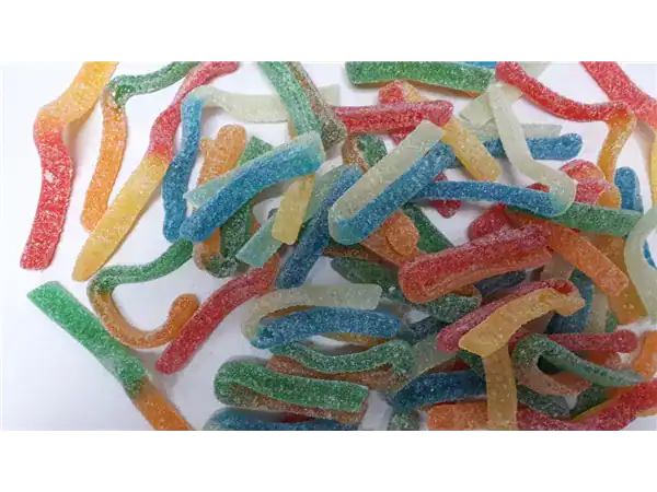 Bright, multicolored gummy worms coated in sugar, perfect for sweet treats and snack options.