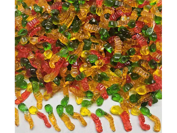 Vibrant gummy worms candies in red, green, yellow, and orange, perfect for snacks and party favors.